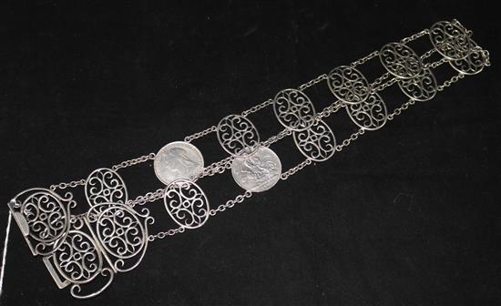 A Victorian silver openwork belt set with two silver crowns (1895 and 1900), Birmingham 1898, Lawrence Emanuel.